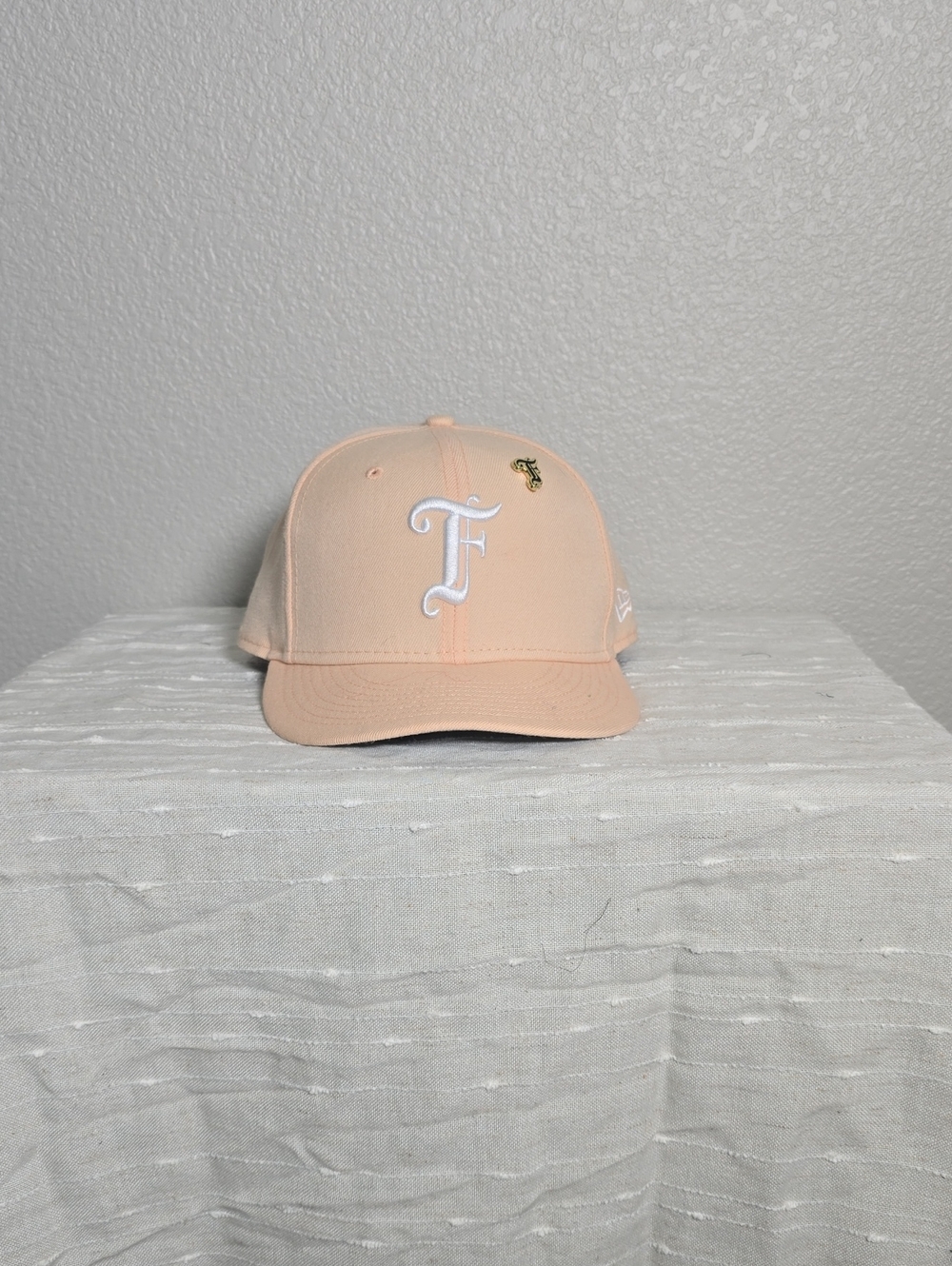 New Era Peach Baseball Cap with White 'F' and Gold Pin